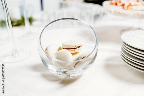 Wedding reception dessert table with delicious decorated white c