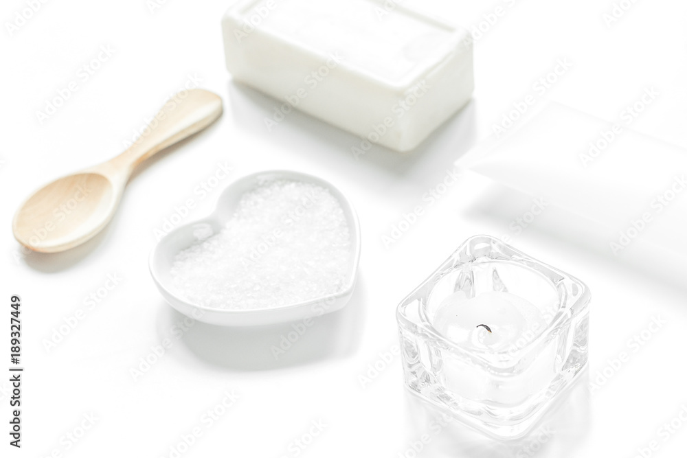 white set of cosmetics for spa on table background white set of cosmetics for spa on table background