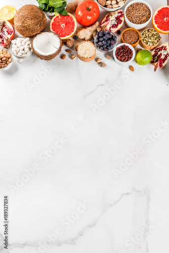 Set of organic healthy diet food, superfoods - beans, legumes, nuts, seeds, greens, fruit and vegetables.. white background copy space. top view