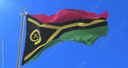 Flag of Vanuatu waving at wind in slow with blue sky, loop photo