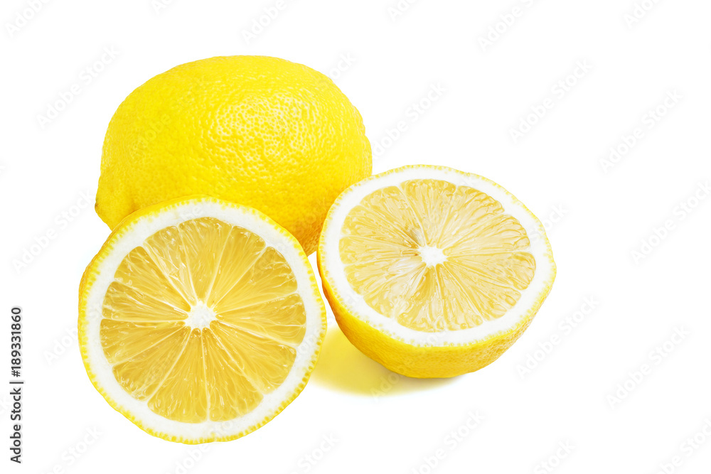 One whole and two halves of yellow ripe lemon fruit, isolated on a white background