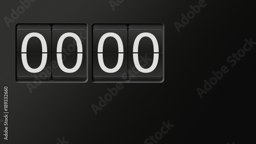 Classic flip clock watch face showing hour and minutes set to 00:00 with white numbers on black background; great copy space; nobody