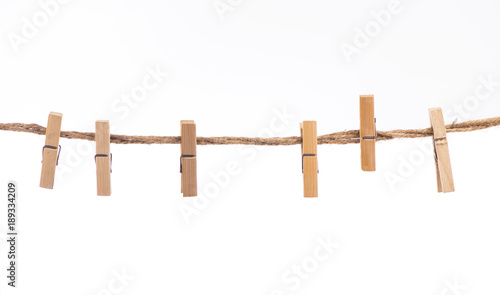 Clothespins with the rope on a white background