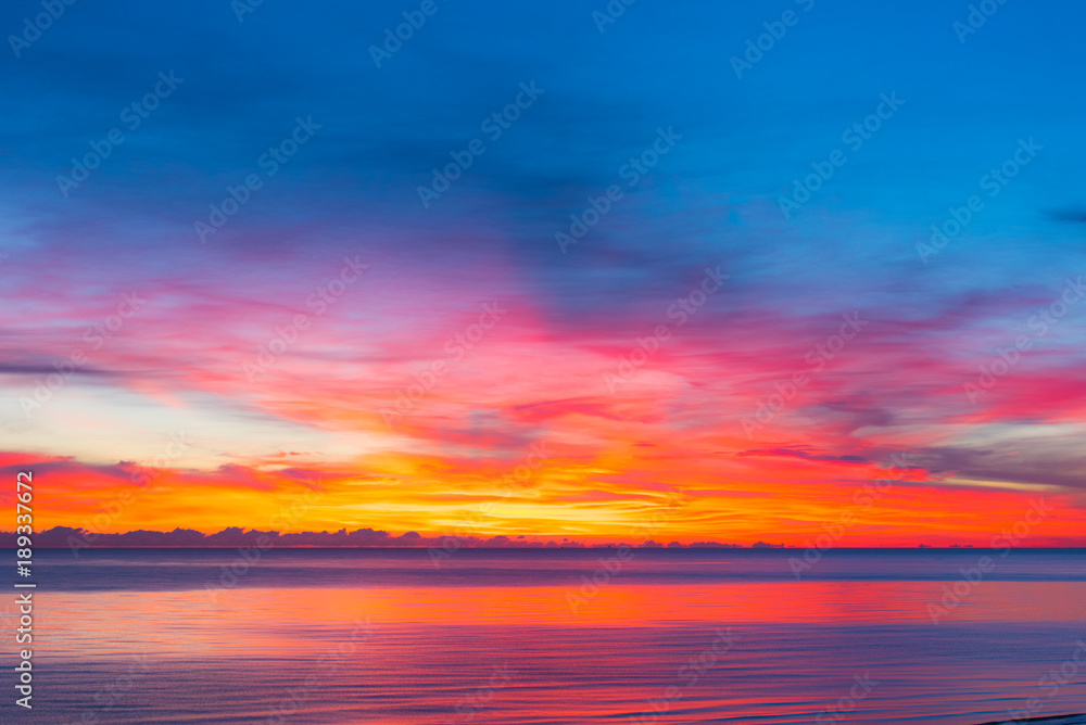 colorful sunset with calm sea and colorful clouds, seascape