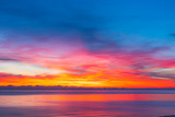 colorful sunset with calm sea and colorful clouds, seascape