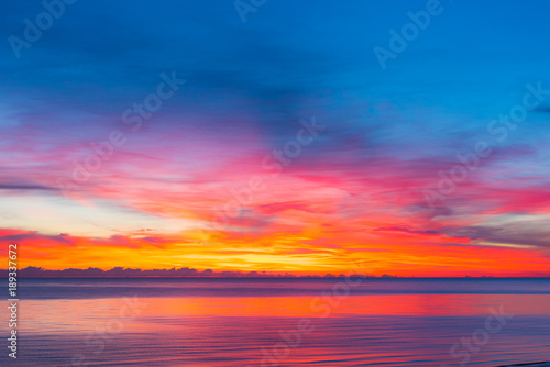 colorful sunset with calm sea and colorful clouds, seascape