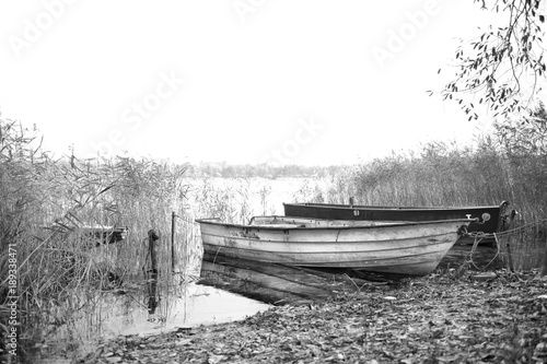 Old fishing boats on a lake's shore