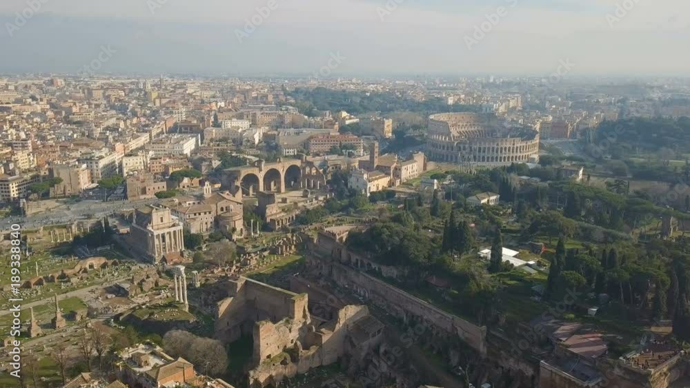 Cityscape of Rome. Aerial view of Colosseum and ancinet Roman ruins Cityscape of Rome. Aerial view of Colosseum and ancinet Roman ruins