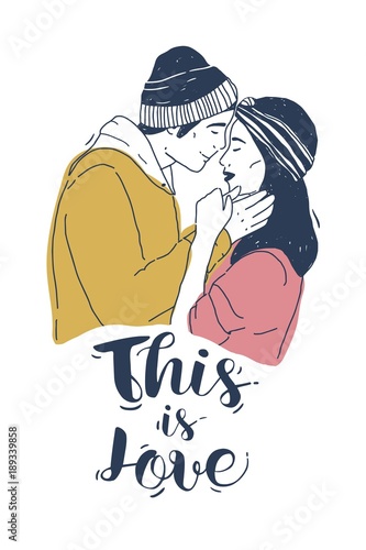 Drawing of pair of young man and woman kissing and This Is Love inscription o...