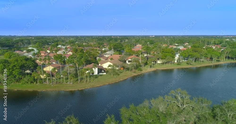 Low aerial flyover homes in Weston Florida residential neighborhood 4k Low aerial flyover homes in Weston Florida residential neighborhood 4k