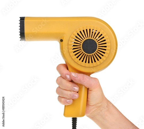 Hand holding an old hairdryer isolated on white background