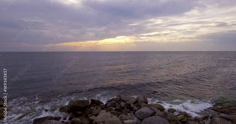 Aerial, beautiful calm sea in the evening and overcast sky Aerial, beautiful calm sea in the evening and overcast sky