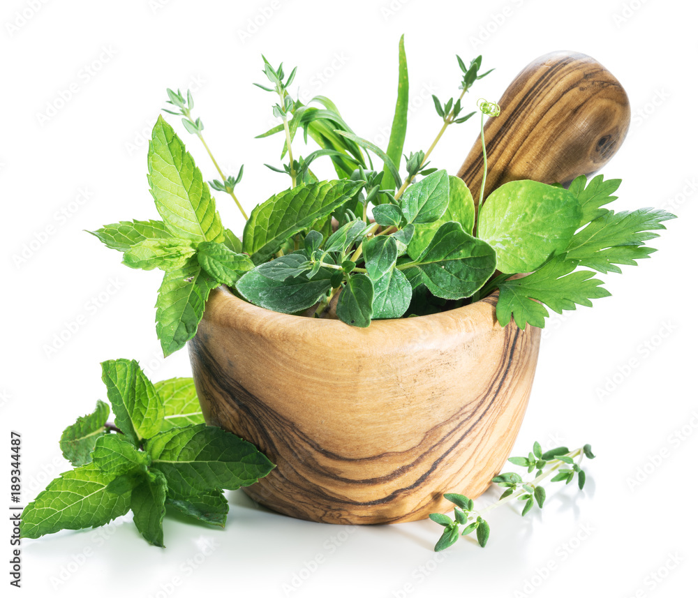 Different fresh green herbs in the wooden mortar. - obrazy, fototapety, plakaty 