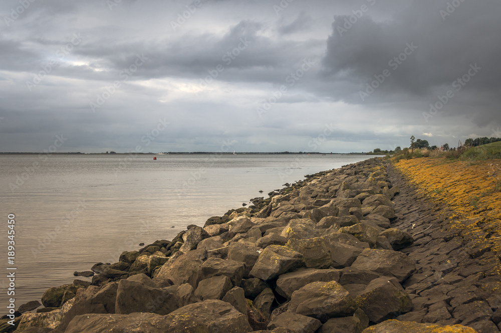 dutch coastline with rocks for dike protection dutch coastline with rocks for dike protection