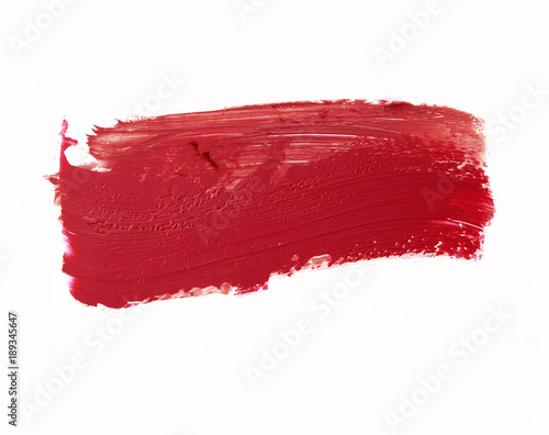 Red color lipstick stroke on white