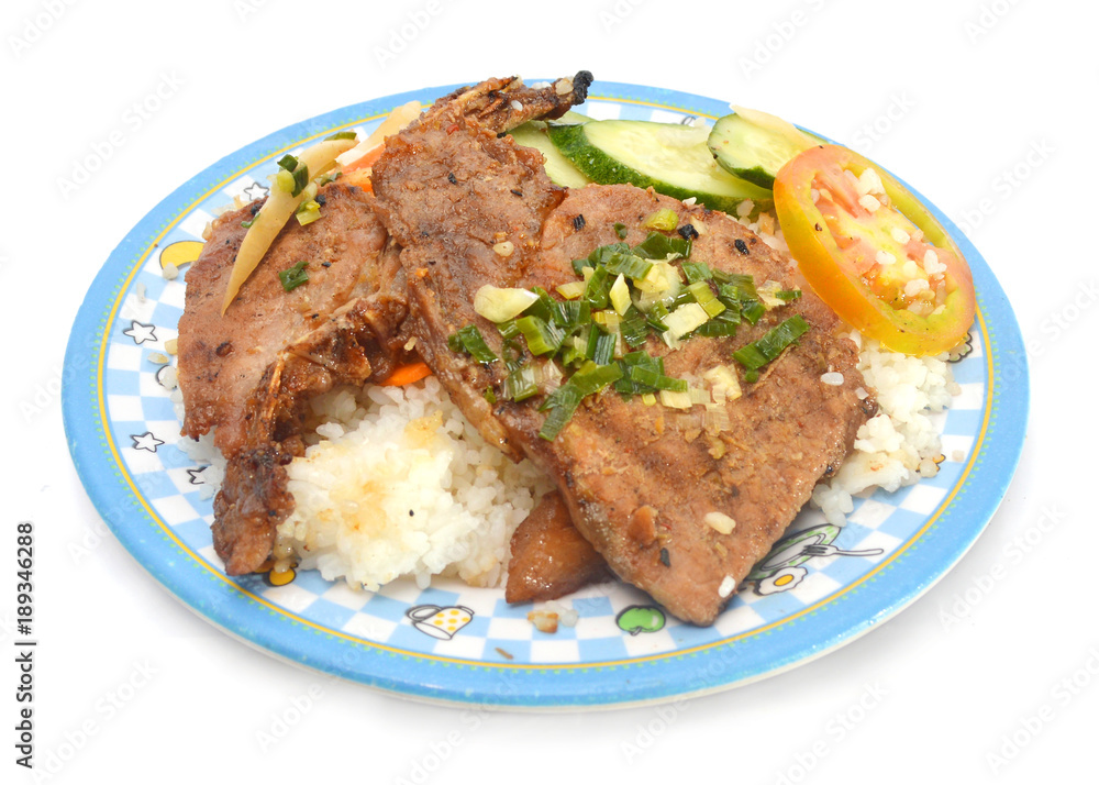 Closeup of vietnamese food: steamed rice dish with meat pie and BBQ pork chop Closeup of vietnamese food: steamed rice dish with meat pie and BBQ pork chop