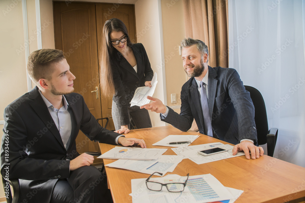 three businessmen at the meeting to communicate