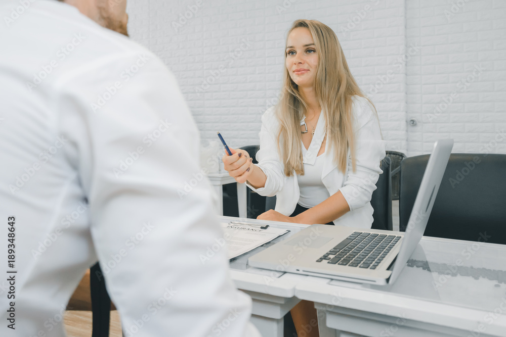 Professional businessman present and offer contract to businesswoman, businesswomen listening to the offer of the contract Professional businessman present and offer contract to businesswoman, businesswomen listening to the offer of the contract