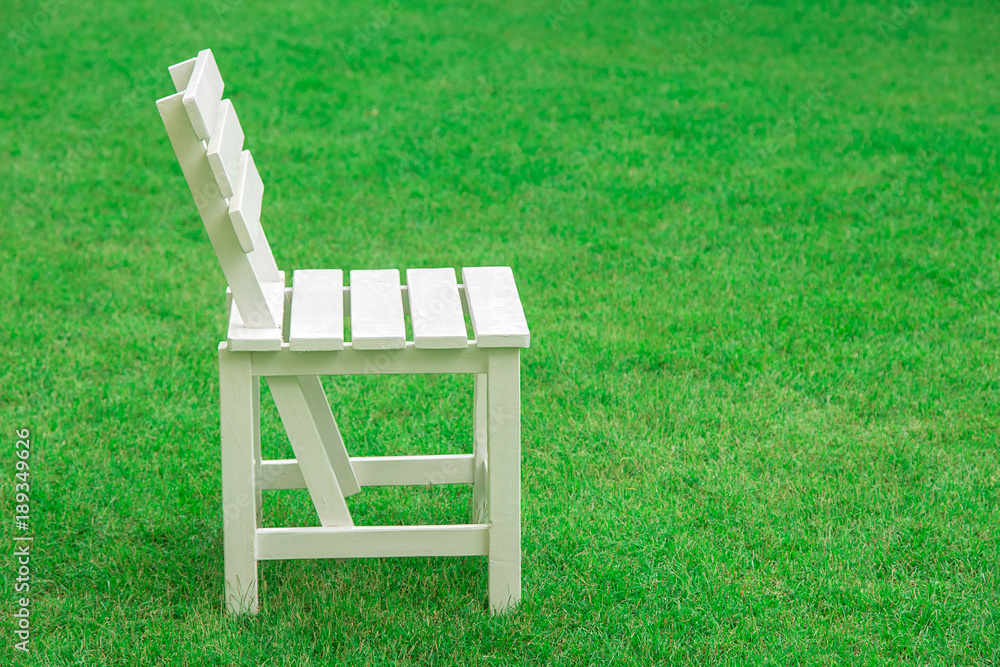 wood chair on nature green grass background. concept for product display template wood chair on nature green grass background. concept for product display template