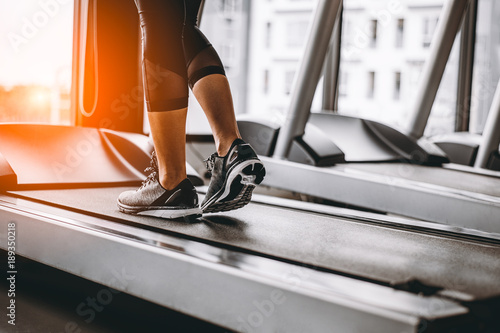 Close up on shoe,Women running in a gym on a treadmill.exercising concept.fitness and healthy lifestyle 