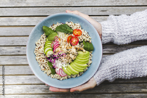 Healthy Quinoa Bulgur bowl with vegetables and chicken photo