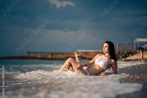 The beautiful girl in bikini on a beach © YURII Seleznov