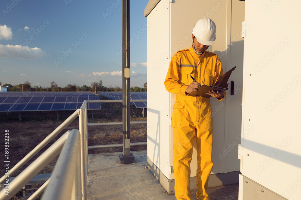 Young engineers are monitoring and recording system to produce solar electricity. Young engineers are monitoring and recording system to produce solar electricity.