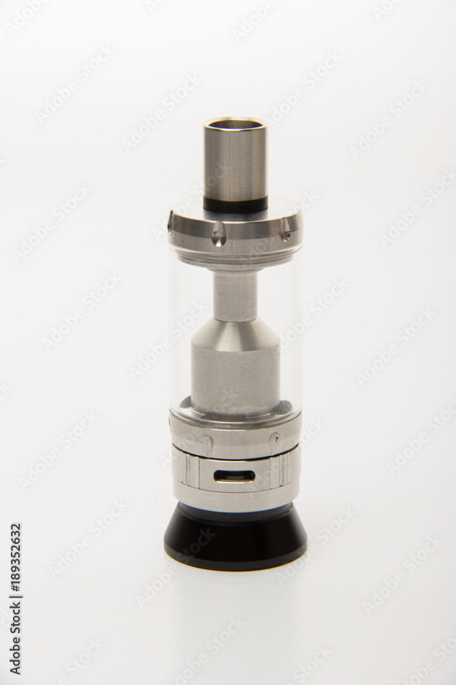 Dismantled parts of the electronic cigarette black and steel colors on a background Dismantled parts of the electronic cigarette black and steel colors on a background