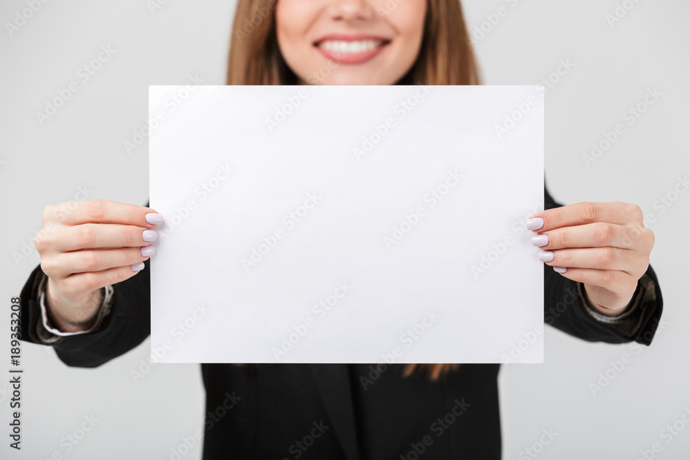Close up of a smiling businesswoman dressed in suit Close up of a smiling businesswoman dressed in suit