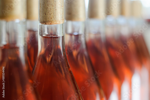 Wine bottles / Cabernet Franc Rose bottles of wine in rows in hungarian wine cellar photo