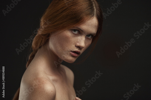 young beautiful woman with red hair posing