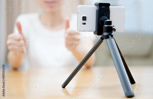 Young woman recording content for her blog