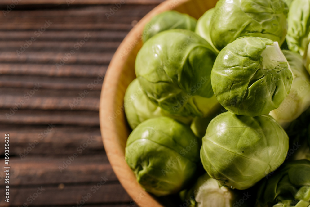 Brussels sprouts on a rustic wooden background Brussels sprouts on a rustic wooden background