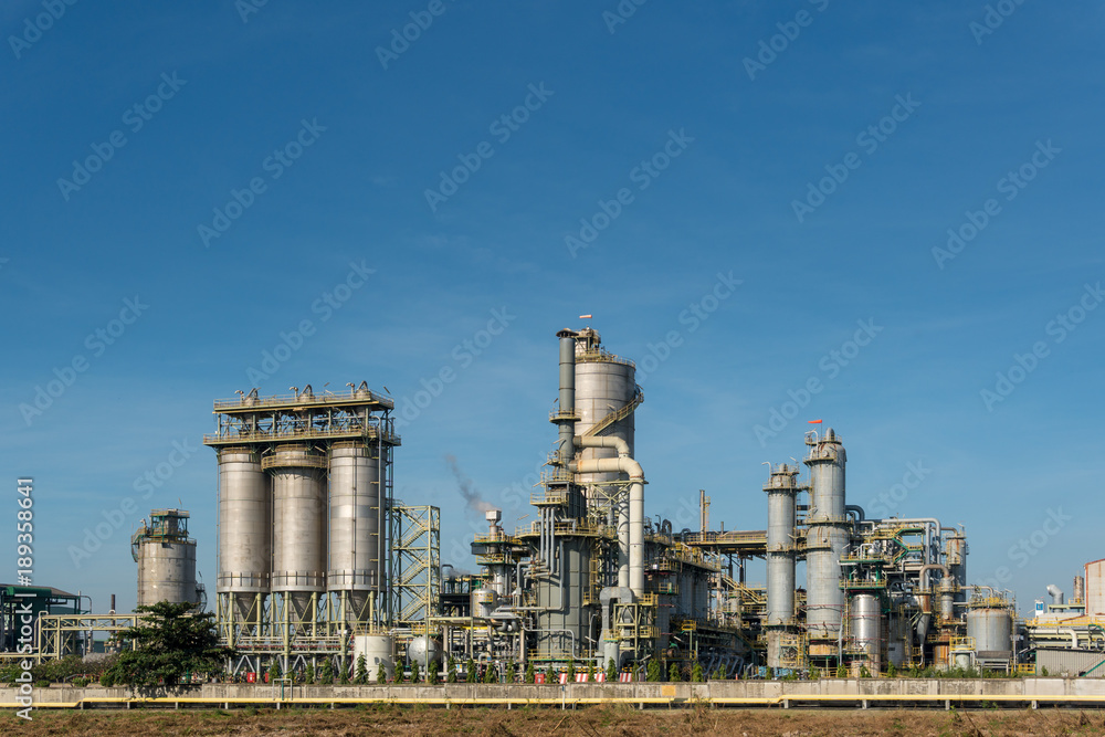Oil refineries and petrochemical plants with blue sky background. with copy space for your text message