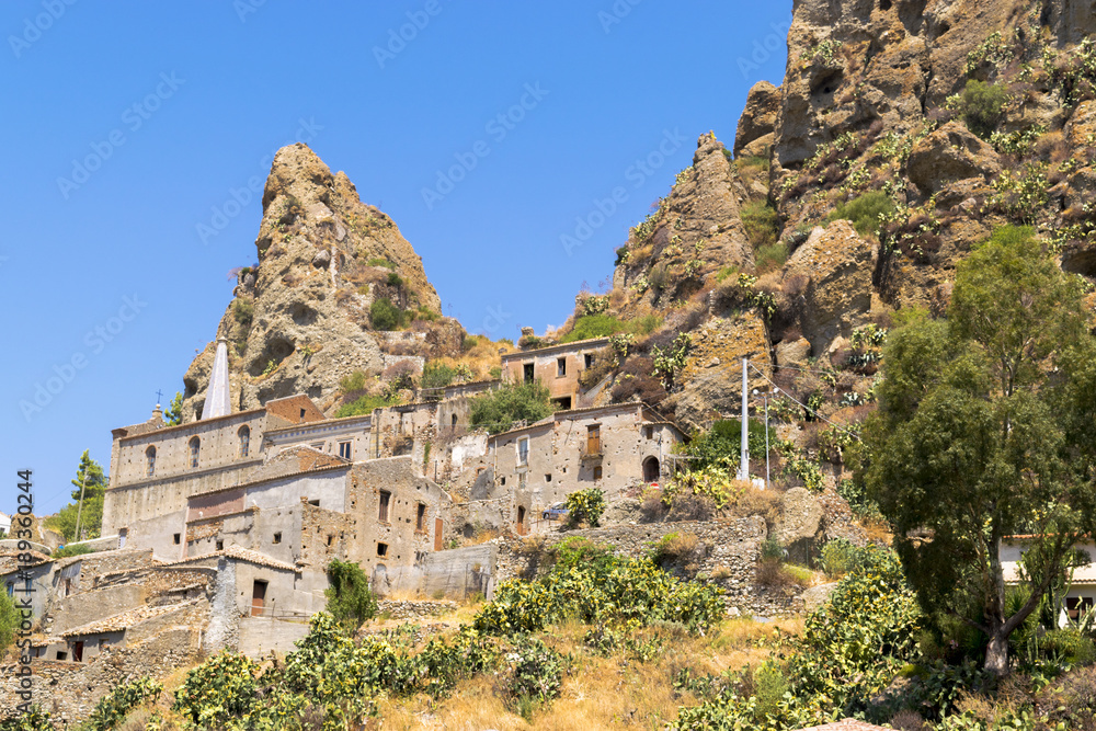 Panorama of an ancient and abandoned village nestled among the arid rocks and wild nature Pentedattilo (calabria)