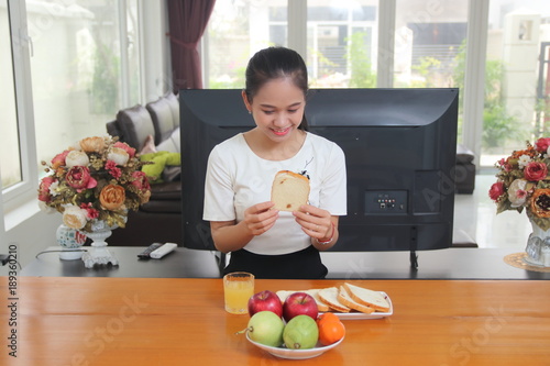 The woman eating breakfast