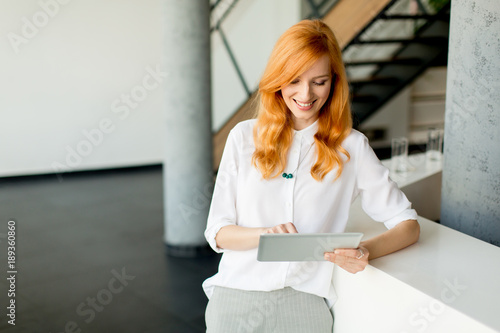 Pretty young red hair woman...