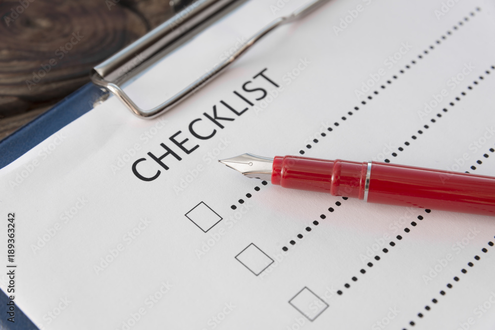 checklist, pen fountain pen, sheet of paper on a wooden background checklist, pen fountain pen, sheet of paper on a wooden background