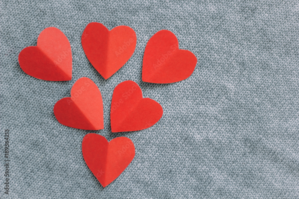 top view paper red hearts grey knitted background top view paper red hearts grey knitted background