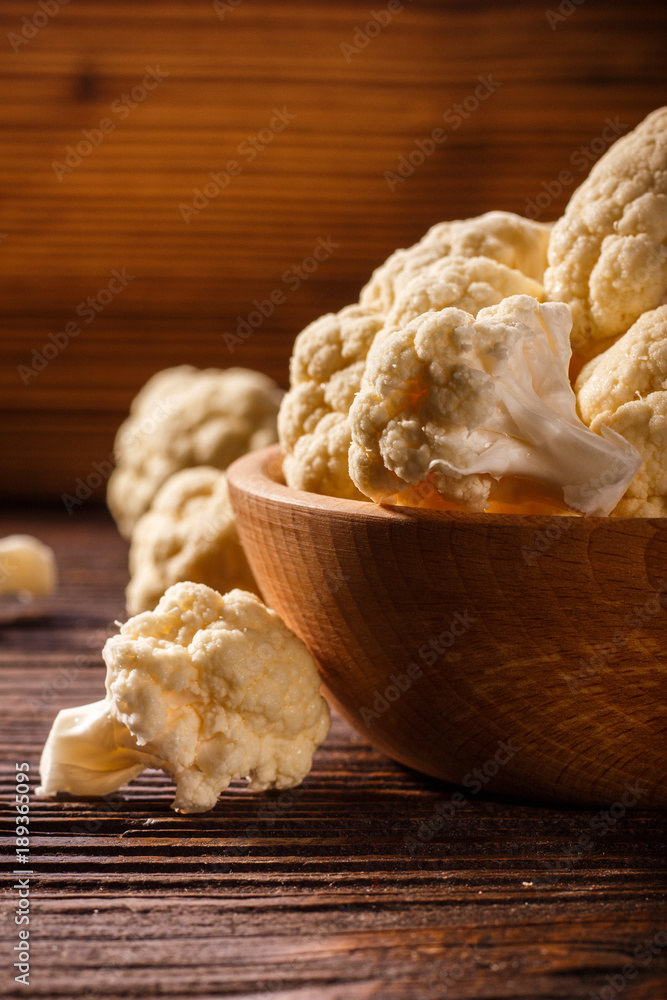 cauliflower and broccoli on a rustic background cauliflower and broccoli on a rustic background