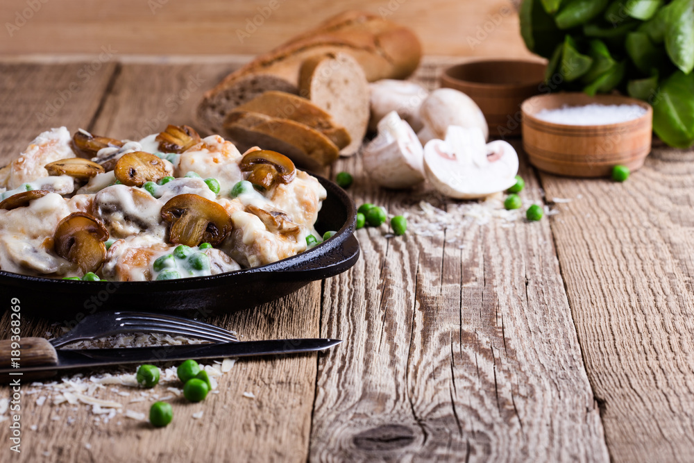 Chicken and mushroom casserole in cast iron skillet Chicken and mushroom casserole in cast iron skillet