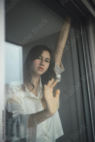 Beautiful woman in the window