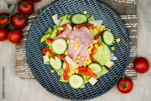 Fresh fruits salad and ham with tomatoes
