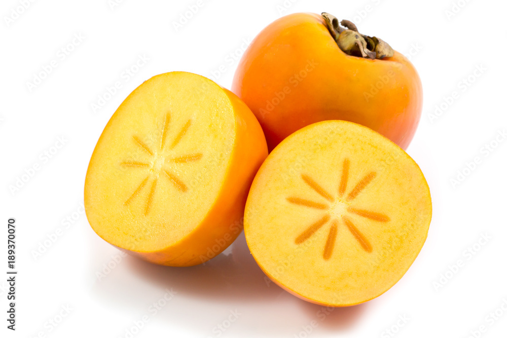 Fresh ripe persimmon fruit isolated on white background, sliced persimmon fruit in white background. Fresh ripe persimmon fruit isolated on white background, sliced persimmon fruit in white background.