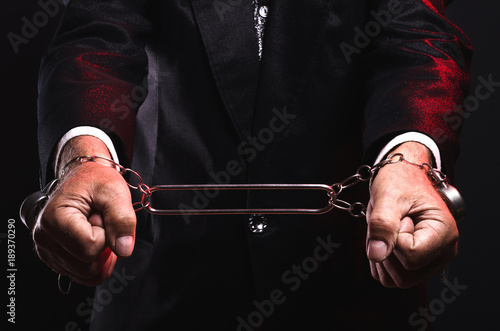 Magician shows trick with chains. Manipulation with props. Sleight of hand.