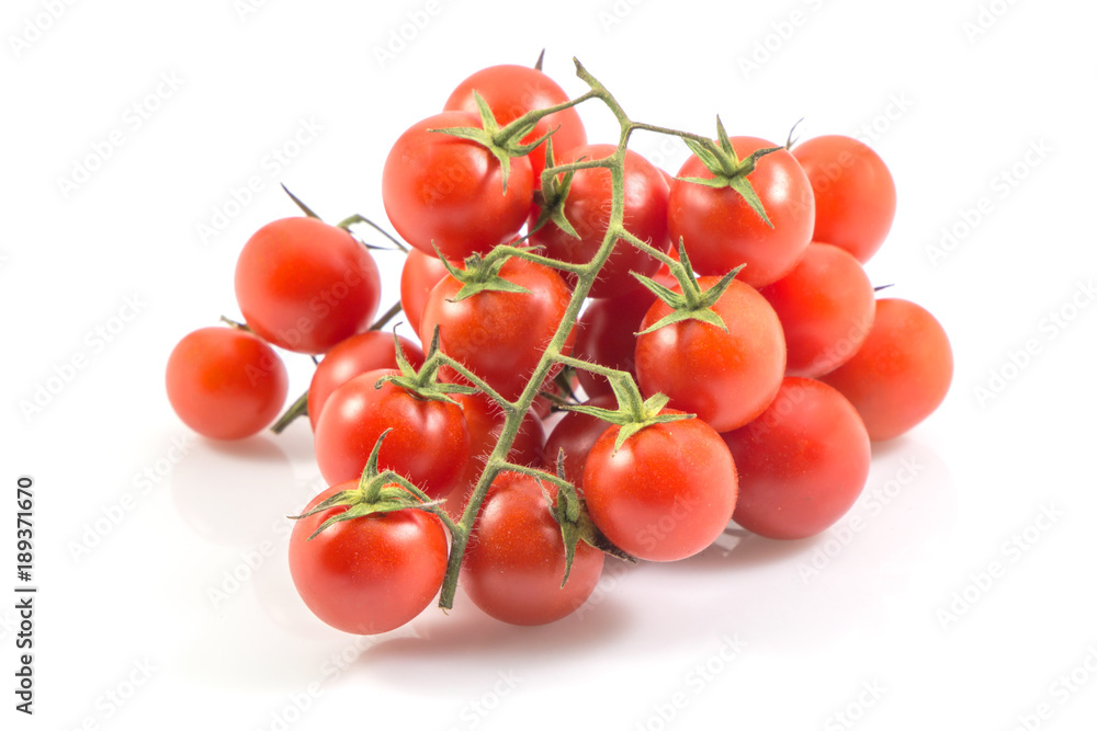 Red tomatoes isolated on white with a clipping path background.