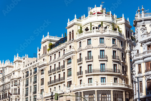 Historical buildings at the Gran Via in Madrid, Spain photo