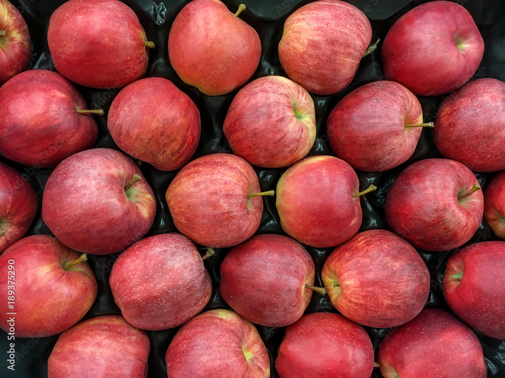 Ripe red apples stacked in a box Ripe red apples stacked in a box