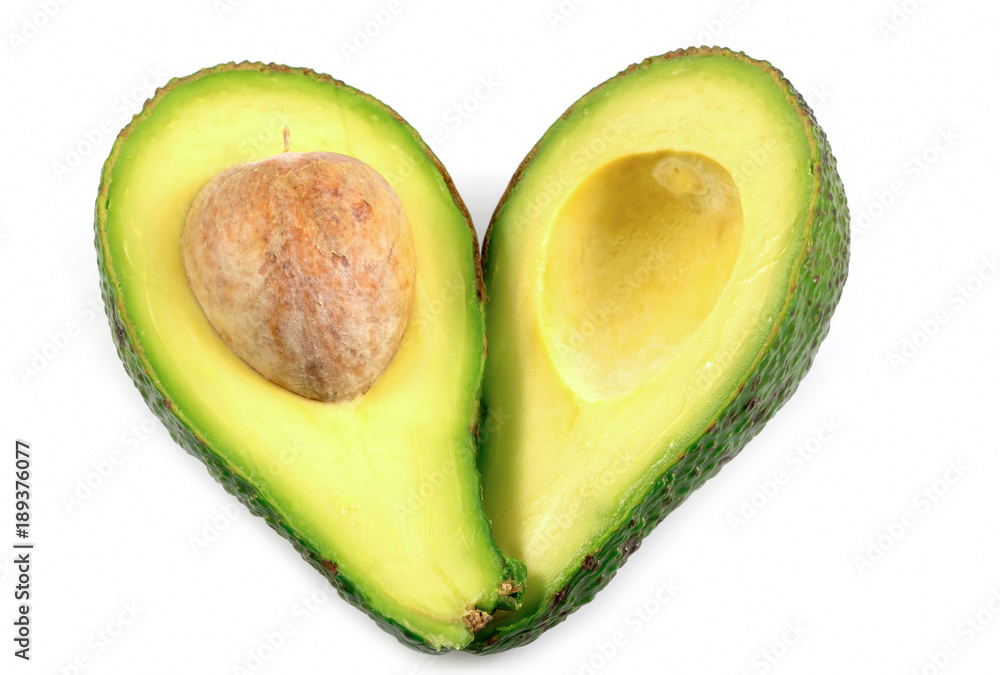 Two slices of fresh avocado with heart symbol isolated on the white background, in healthy concept with clipping path.