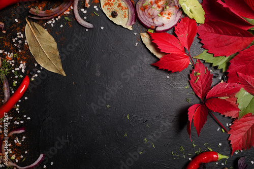autumnal kitchen veggies pieces negative space concept. food ingredients on dark background. vegan lifestyle